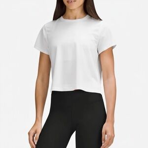Lululemon Ultralight Waist-Length T-Shirt
White Cropped Crew Tee Size: 2